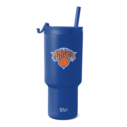 Royal blue tumbler with New York Knicks logo featuring orange and white design accents