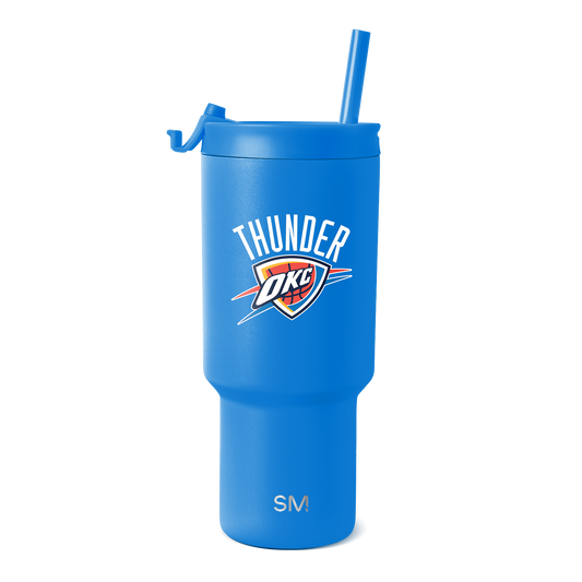 Royal blue insulated tumbler with white, red, orange, and navy blue design accents on cylindrical body