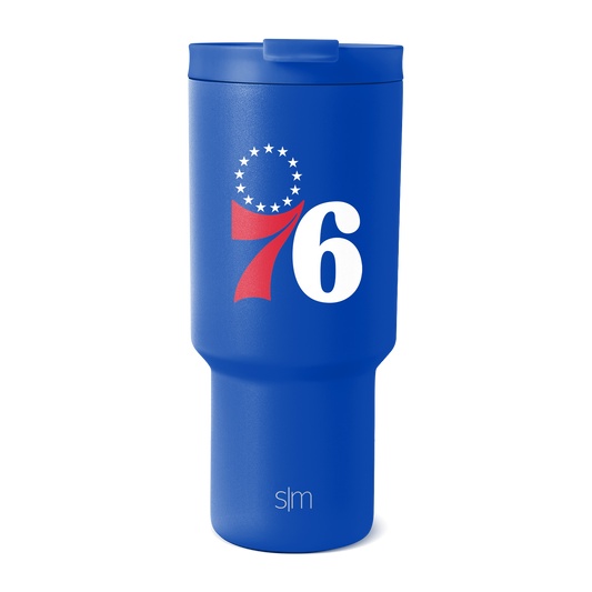 Royal blue insulated tumbler with white text, graphic logo, and red accents in patriotic design