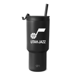 Matte black insulated tumbler with matching black straw and lid cap, featuring a cylindrical design with charcoal undertone for a monochromatic look.
