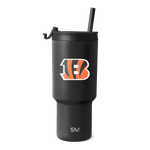Matte black tumbler with orange and white accents on white background