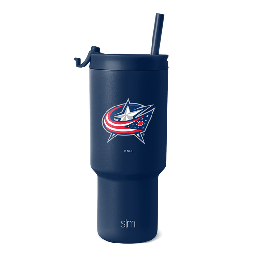 Navy blue insulated tumbler with fitted lid and matching straw on white background. Cylindrical shape with wider base tapering toward top.