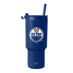 Royal blue tumbler with white text branding and orange accent details