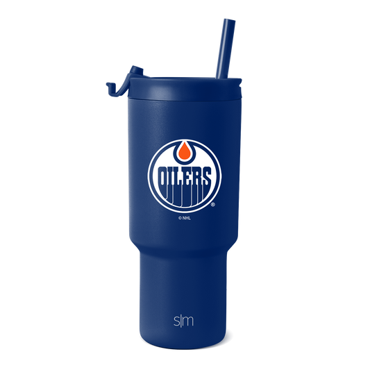Royal blue tumbler with white text branding and orange accent details