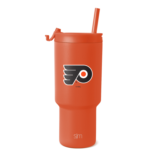 Vibrant coral-orange tumbler on white background