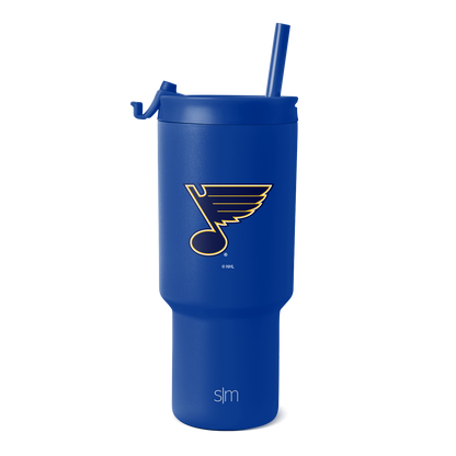Bright royal blue tumbler with glossy finish, featuring St. Louis Blues team logo and SM branding in gold and cream.