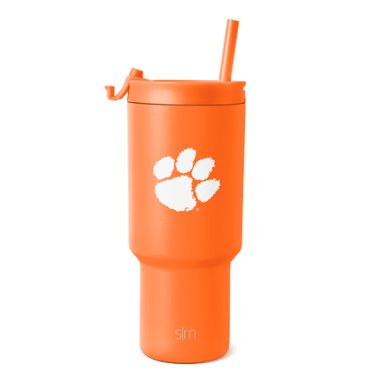 Bright orange tumbler with white paw print graphic and brand text
