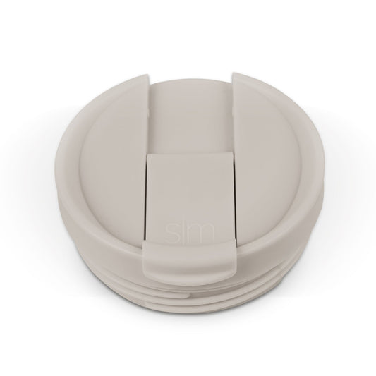 Beige and cream colored flip-top lid with matching components in light taupe, shown in monochromatic neutral tones
