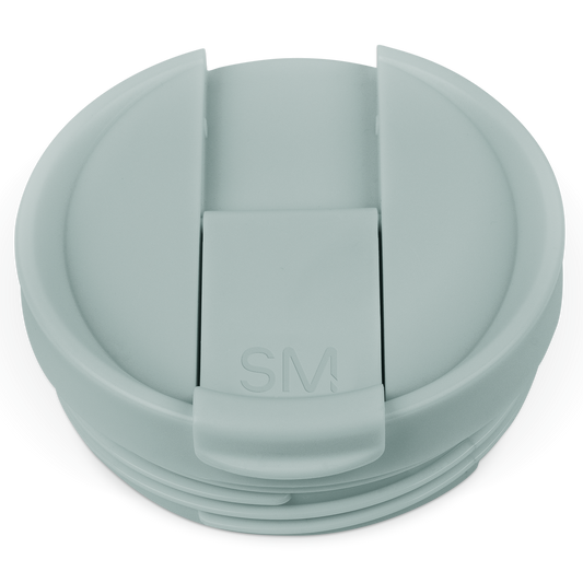 Sage green flip lid container with soft muted finish on white background