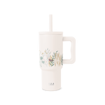 Cream-colored tumbler with muted watercolor botanical illustration on front
