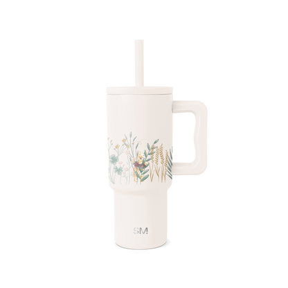 Cream-colored tumbler with muted watercolor botanical illustration on front