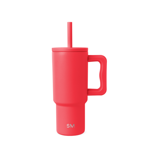 Coral-red insulated tumbler with handle and matching straw on white background. Features SM logo on front. Modern, cylindrical design with ergonomic grip. Product photography.