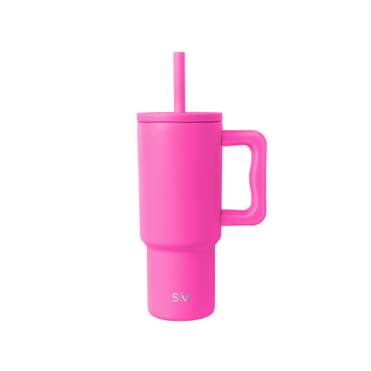Hot pink reusable drinkware with lid on white background