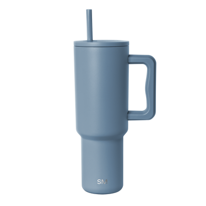 Slate blue insulated tumbler with tapered cylindrical design and minimalist contemporary aesthetic
