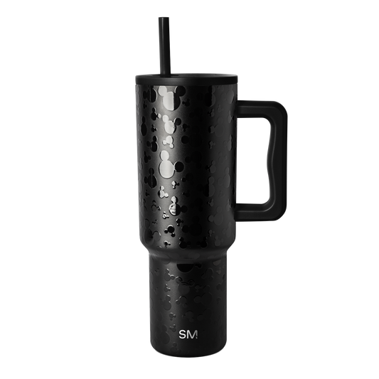 Matte black stainless steel tumbler with handle, cylindrical shape with tapered top, on white background