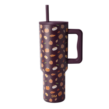 Deep burgundy autumn tumbler with warm golden accents, modern minimalist design