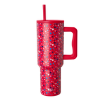 Red tumbler with scattered white geometric shapes and stars pattern