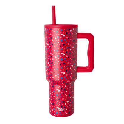 Red tumbler with scattered white geometric shapes and stars pattern