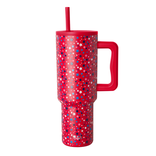 Red tumbler with scattered white geometric shapes and stars pattern