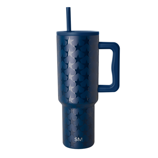 Deep navy blue tumbler with silvery-blue tonal pattern, isolated on white background