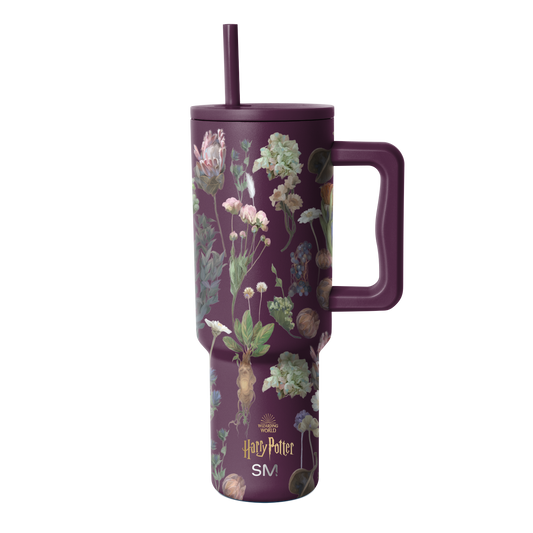 Purple tumbler with botanical illustration pattern featuring cream, pale pink, soft green, and muted gold accents