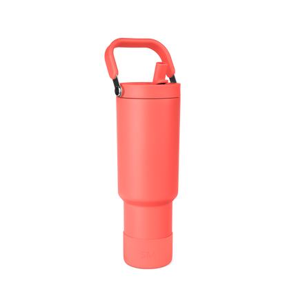 Coral-red insulated water bottle with black handle and carabiner clip on white background