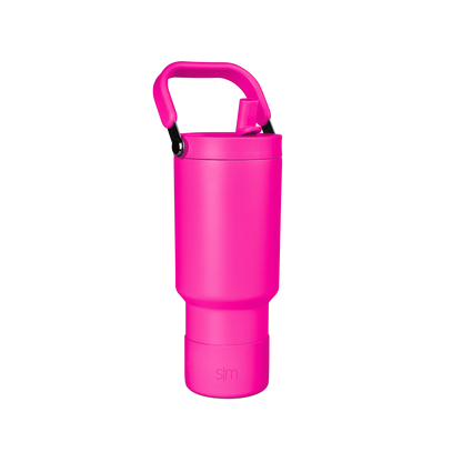 Vibrant hot pink cylindrical vessel with matching handle against white background