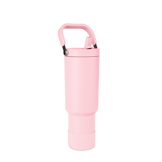 Tall cylindrical pale pink water bottle with rounded tapered design and wider middle section on white background