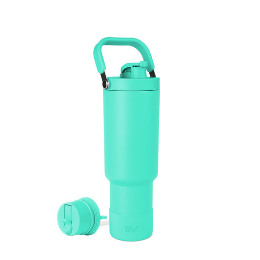 Turquoise insulated bottle with black carry handle accent against white background