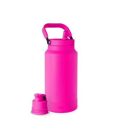 Bright hot pink spray bottle with white background