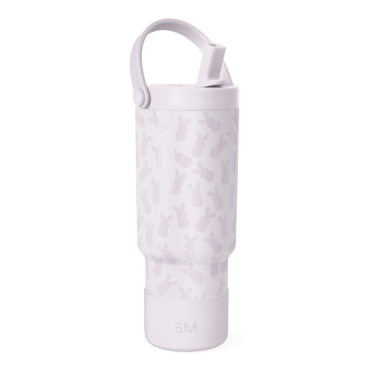 Pale lavender bottle with darker mauve camouflage pattern, featuring a handle and top rim detail.