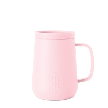 Pale pink ceramic mug on white background, viewed from front angle, featuring clean minimalist design suitable for everyday use or gifting.
