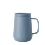 Dusty slate blue ceramic mug with muted powder finish, displayed against a neutral background