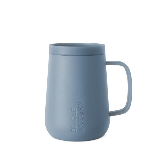 Dusty slate blue ceramic mug with muted powder finish, displayed against a neutral background