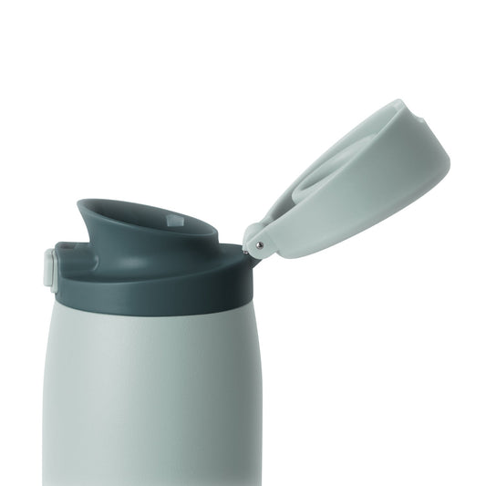 Pale seafoam and sage green ceramic vessel with mint green body and matching lid and spout hardware